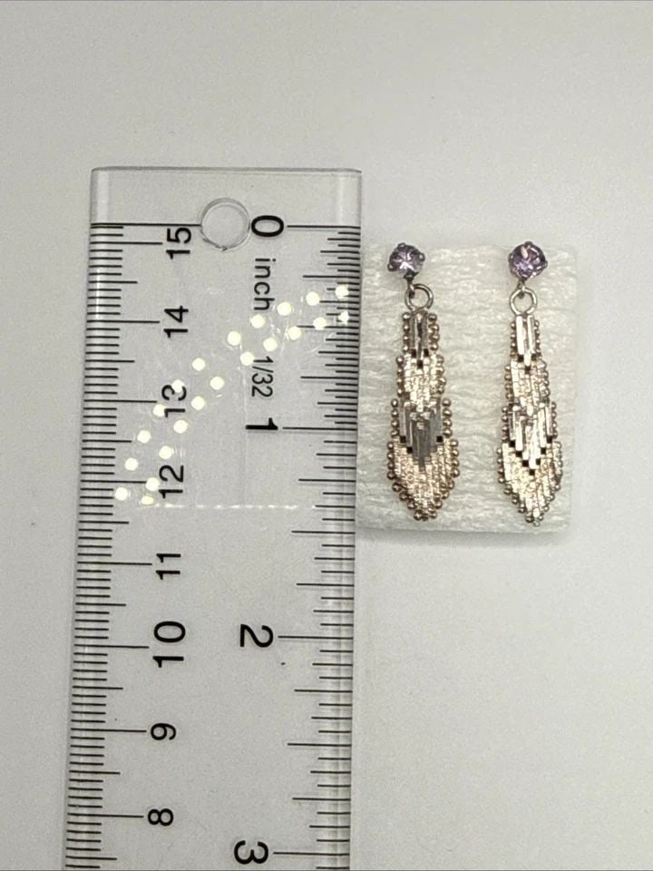 STERLING SILVER MESH EARRINGS WITH LIGHT PURPLE STONE: STERLING SILVER MESH EARRINGS WITH LIGHT PURPLE STONE These Sterling Silver Mesh Earrings feature a delicate dangle/drop style, perfect for adding a touch of elegance to any outfit. The earrings are m