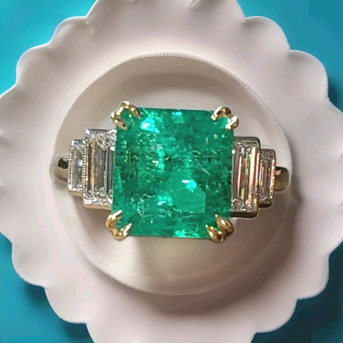 Vintage Platinum 18k Yellow Gold Ring 4.93ct. Natural Colombia Emerald GIA Cert: This vintage platinum ring is a stunning piece of fine jewelry that would make a perfect addition to any collection. The ring features a platinum and 18k yellow gold base metal and is adorned with a n