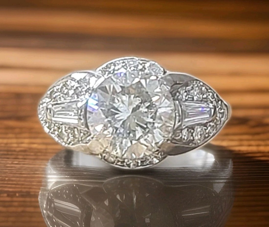 Platinum Vintage Engagement Ring 2.57ct. Natural Round Diamond Circa 1930's: PLATINUM VINTAGE ENGAGEMENT RING 2.57CT. NATURAL ROUND DIAMOND CIRCA 1930'S This exceptional vintage Art Deco engagement ring is finely crafted in solid platinum and dates to the 1930s. At its center 