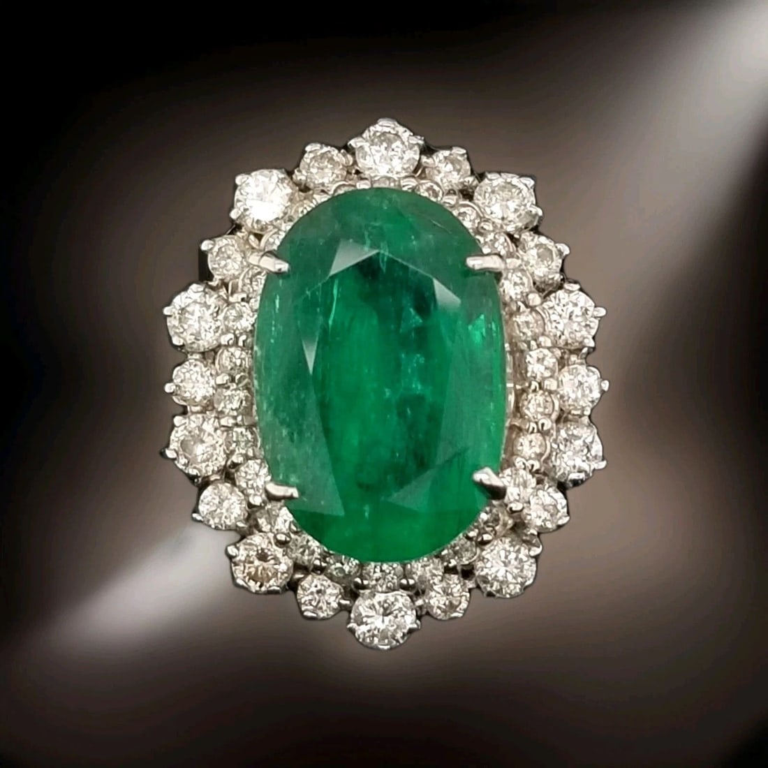 14K White Gold Engagement Ring with 10.25ct Natural Oval Green Emerald Diamond: 14K WHITE GOLD RING 10.25CT. NATURAL GREEN OVAL SHAPE Gorgeous 14k white gold natural green emerald ring center natural emerald Oval cut weight 10.25ct. Size 17x11.5 gorgeous color nice luster ,nice c