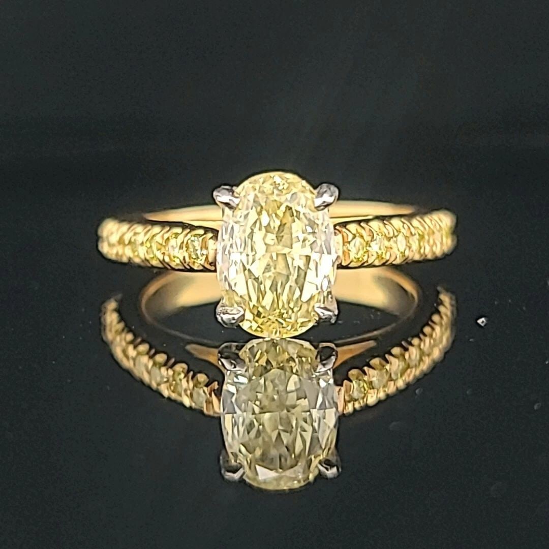 18K YELLOW GOLD ENGAGEMENT RING 1.77CT. NATURAL FANCY INTENSE YELLOW DIAMOND: 18K YELLOW GOLD ENGAGEMENT RING 1.77CT. NATURAL FANCY INTENSE YELLOW DIAMOND GORGEOUS 18K Yellow GOLD natural fancy intense yellow diamond in oval shape Center weight 1.77ct. size 8.6x6.2mm very nice 