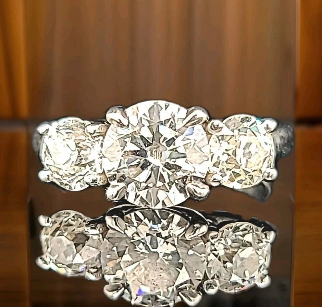 Vintage Platinum Three-Stone Engagement Ring 2.33ct. old Euro-cut Diamond: 2.33CT. VINTAGE PLATINUM THREE-STONE ENGAGEMENT RING OLD EURO-CUT DIAMOND Here is an outstanding platinum diamond engagement ring,the beautiful three stone diamond design gives this ring amazing appea