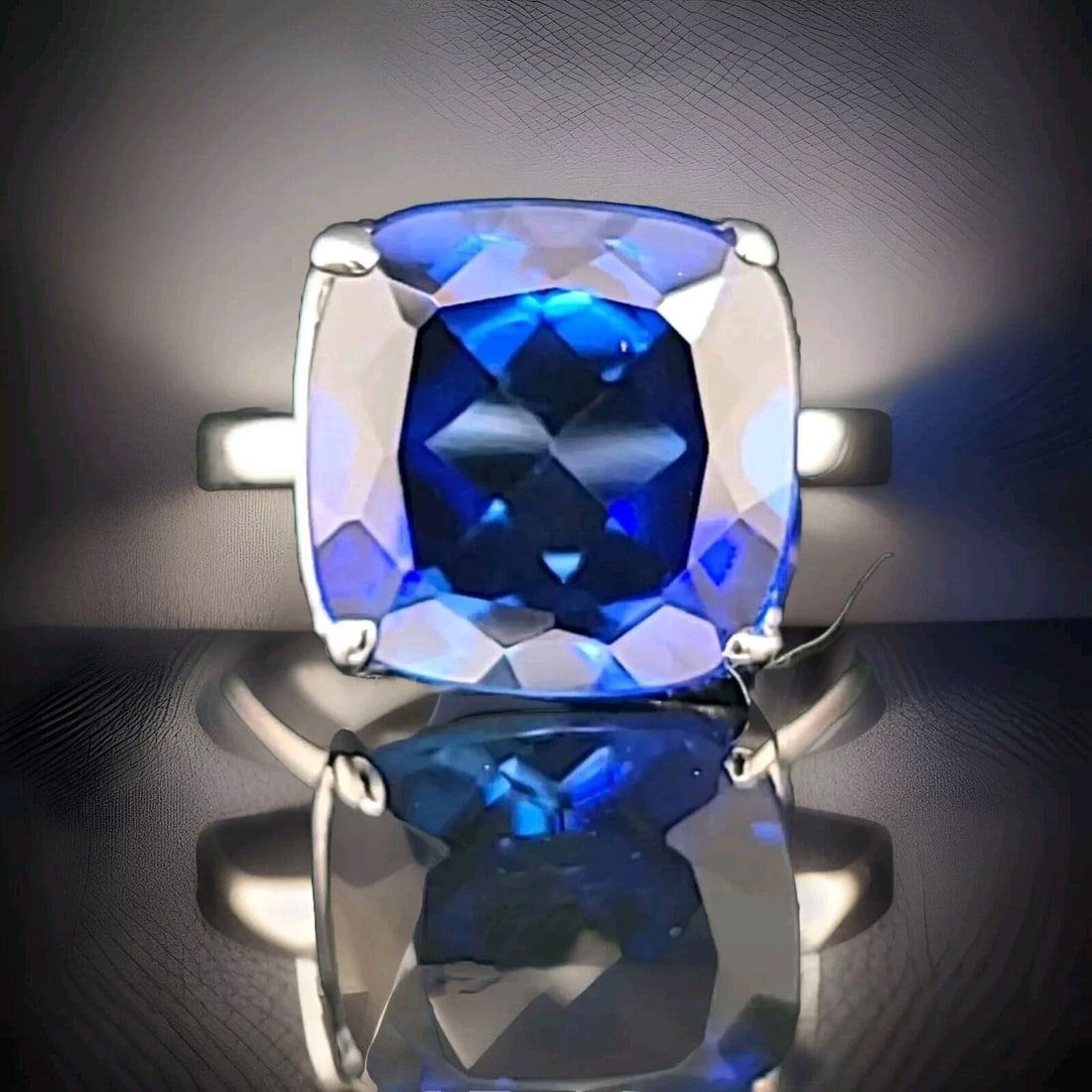 Tiffany & Co 18K White Gold Engagement Ring 14.25ct. Blue Sapphire Cushion Cut: TIFFANY & CO 18K WHITE GOLD ENGAGEMENT RING 14.25CT. BLUE SAPPHIRE CUSHION CUT This stunning ring from Tiffany & Co. is the perfect choice for any special occasion, whether it's for an engagement, bir