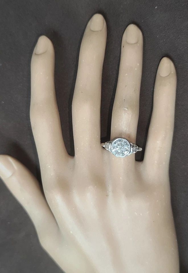 Platinum Vintage Filigree Engagement Ring 2.32ct. Natural Round Diamond 1930'S: PLATINUM VINTAGE FILIGREE ENGAGEMENT RING 2.32CT. NATURAL ROUND DIAMOND 1930'S This enchanting Art Deco engagement ring captures the romance of a bygone era, featuring a natural 2.32-carat round diamo