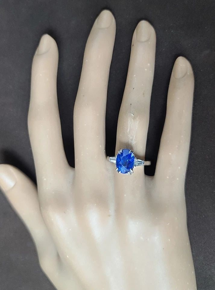 Vintage Platinum Engagement Ring 4.51ct. Natural Oval Blue Sapphire GIA cert: VINTAGE PLATINUM ENGAGEMENT RING 4.51CT. NATURAL OVAL BLUE SAPPHIRE GIA CERT This vintage platinum engagement ring is a stunning piece of fine jewelry that will capture her heart. The ring features a 