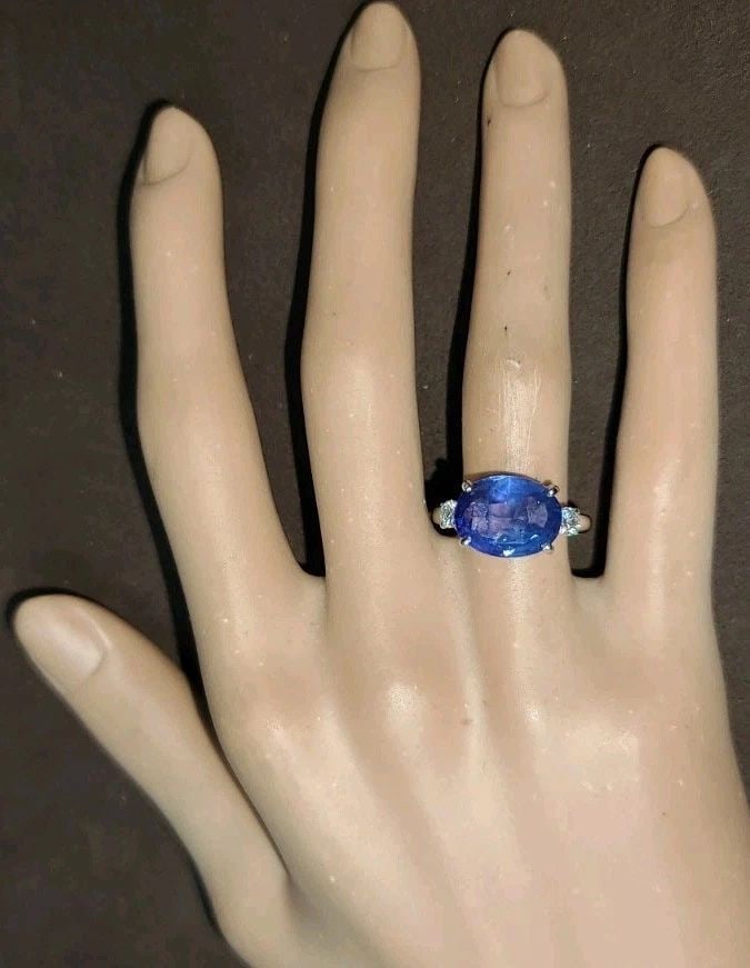 Vintage Platinum Engagement Ring 5.03CT.Natural Untreated Blue Oval Sapphire GIA: VINTAGE PLATINUM ENGAGEMENT RING 5.03CT.NATURAL UNTREATED BLUE OVAL SAPPHIRE GIA This Vintage Platinum Engagement Ring features a stunning 5.03CT Natural Untreated Blue Oval Sapphire as the main stone