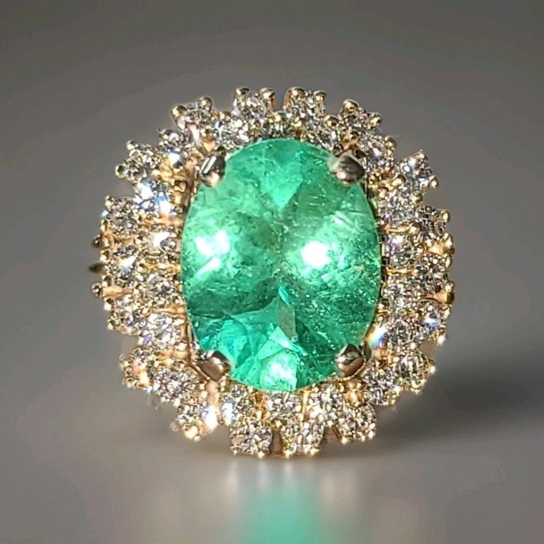 Vintage 14k Yellow Gold Engagement Ring 4.79CT.Natural Colombia Emerald GIA Cert: VINTAGE 14K YELLOW GOLD ENGAGEMENT RING 4.79CT.NATURAL COLOMBIA EMERALD GIA CERT This 14k Yellow Gold Engagement Ring features a stunning 4.79CT Natural Colombia Emerald in an Oval shape, with a GIA c