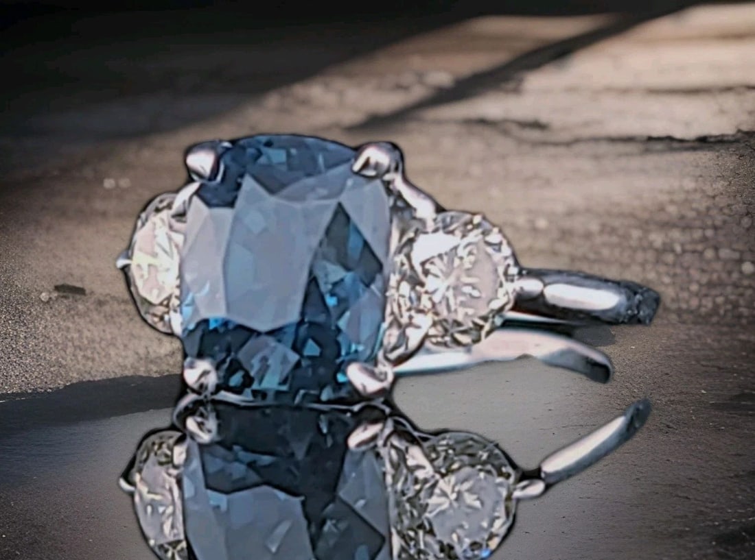 14k White Gold Engagement Ring 4.04CT.Natural No Heat Blue Sapphire Cushion GIA: 14K WHITE GOLD ENGAGEMENT RING 4.04CT.NATURAL NO HEAT BLUE SAPPHIRE CUSHION GIA This elegant engagement ring is crafted in solid 14K white gold and showcases a stunning natural teal blue sapphire in a