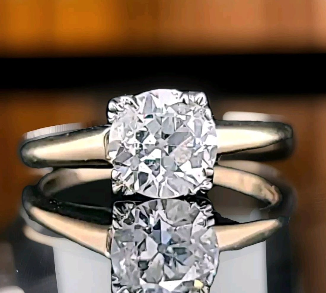 Vintage 18k Two-Tone Gold Engagement Ring 1.45ct. Natural Old Euro Round Diamond: This is a vintage 18k - 14k two-tone gold engagement ring with a 1.45ct natural old euro round diamond. The ring features a cocktail style with a prong setting and is certified by AGI. The diamond col