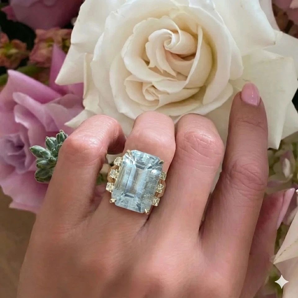 Vintage 14k Yellow Gold Engagement Ring 21.56ct.Natural Aquamarine Emerald Cut: VINTAGE 14K YELLOW GOLD ENGAGEMENT RING 21.56CT.NATURAL AQUAMARINE EMERALD CUT This breathtaking vintage 14K yellow gold engagement ring is a true statement of timeless elegance, showcasing a magnific