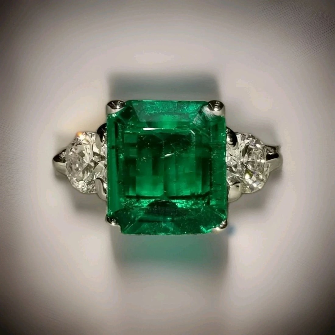 14K White Gold Three Stones Engagement Ring 3.18CT. Lab Grown Green Emerald: 14K WHITE GOLD THREE STONES ENGAGEMENT RING 3.18CT.GREEN COLOMBIA EMERALD GORGEOUS 14K white gold emerald ring center lab Grown EMERALD. weight 3.18ct. size 10.7X9.4X3.9mm nice vivid green color ,clea