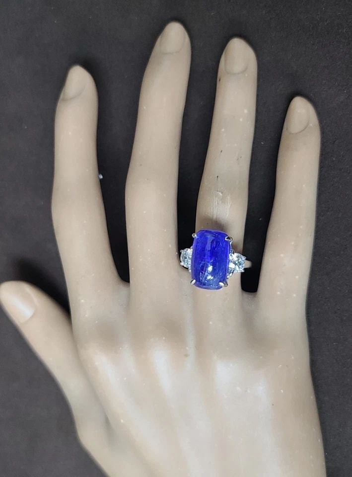 Vintage 14k White Gold Ring 10.83CT.Natural Tanzanite Cushion Cabochon shape: VINTAGE 14K WHITE GOLD RING 10.83CT.NATURAL TANZANITE CUSHION CABOCHON SHAPE This Vintage 14k White Gold Ring features a beautiful 10.83CT natural Tanzanite cushion cabochon shape as the main stone. T