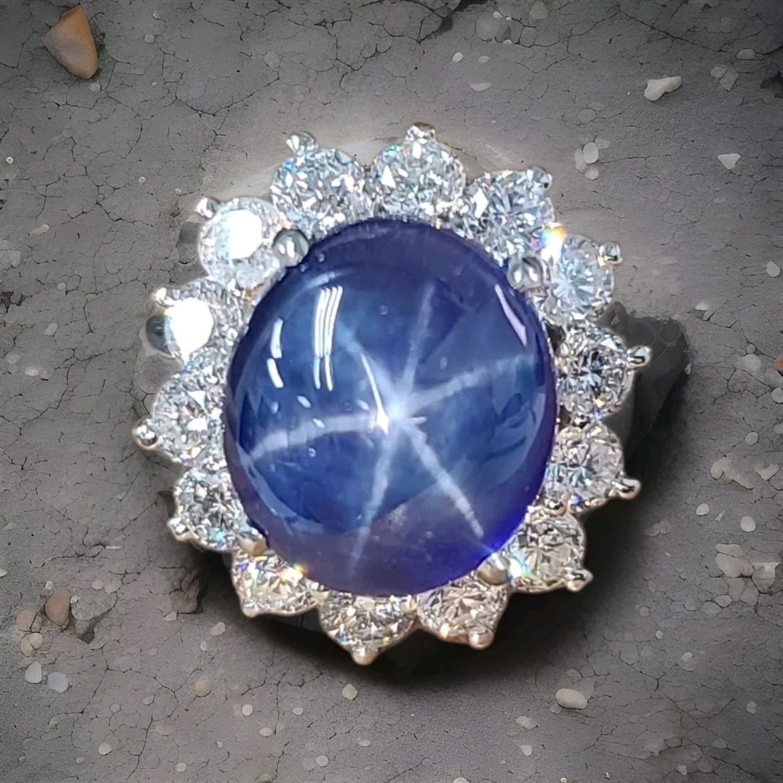 14K White Gold Ring 13.42CT. Gem Blue Star Sapphire Cabochon Shape: 14K WHITE GOLD RING 13.42CT. GEM BLUE STAR SAPPHIRE CABOCHON SHAPE Gorgeous 14k White gold blue star sapphire ring,center lab-grown blue star sapphire oval cabochon shape, size 13.7x12.1mm weight 13.4