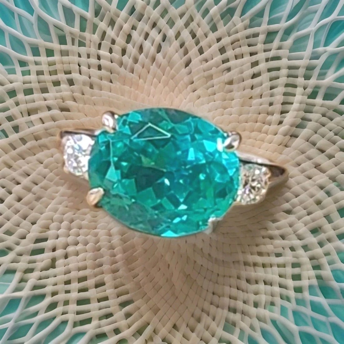 Vintage Platinum Engagement Ring 7.27ct. Blue Neon Tourmaline Oval Shape: VINTAGE PLATINUM ENGAGEMENT RING 7.27CT. BLUE NEON TOURMALINE OVAL SHAPE This exquisite vintage ring showcases a 7.27-carat oval-cut lab-grown blue tourmaline (12 × 10 mm) with a vibrant neon blue co