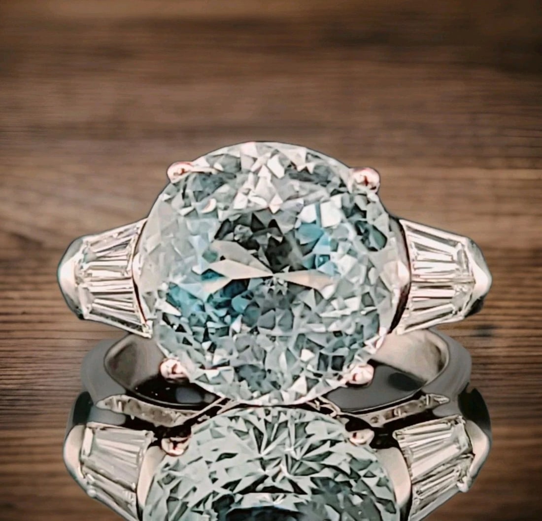 Vintage Platinum Engagement Ring 6.67ct. Natural Sky Blue Aquamarine Round Cut: VINTAGE PLATINUM ENGAGEMENT RING 6.67CT. NATURAL SKY BLUE AQUAMARINE ROUND CUT The Vintage Platinum Engagement Ring features a stunning 6.67ct natural sky blue aquamarine with a round cut. This unique