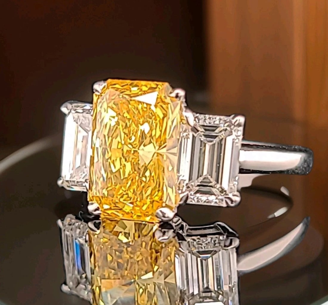 14k Yellow Gold Engagement Ring 2.66CT.Lab Grown Yellow Diamond Radiant Shape: 14K YELLOW GOLD ENGAGEMENT RING 2.66CT.LAB GROWN YELLOW DIAMOND RADIANT SHAPE This 14k Yellow Gold Engagement Ring features a stunning 2.66CT Lab Grown Yellow Diamond in a Radiant Shape, making it a b