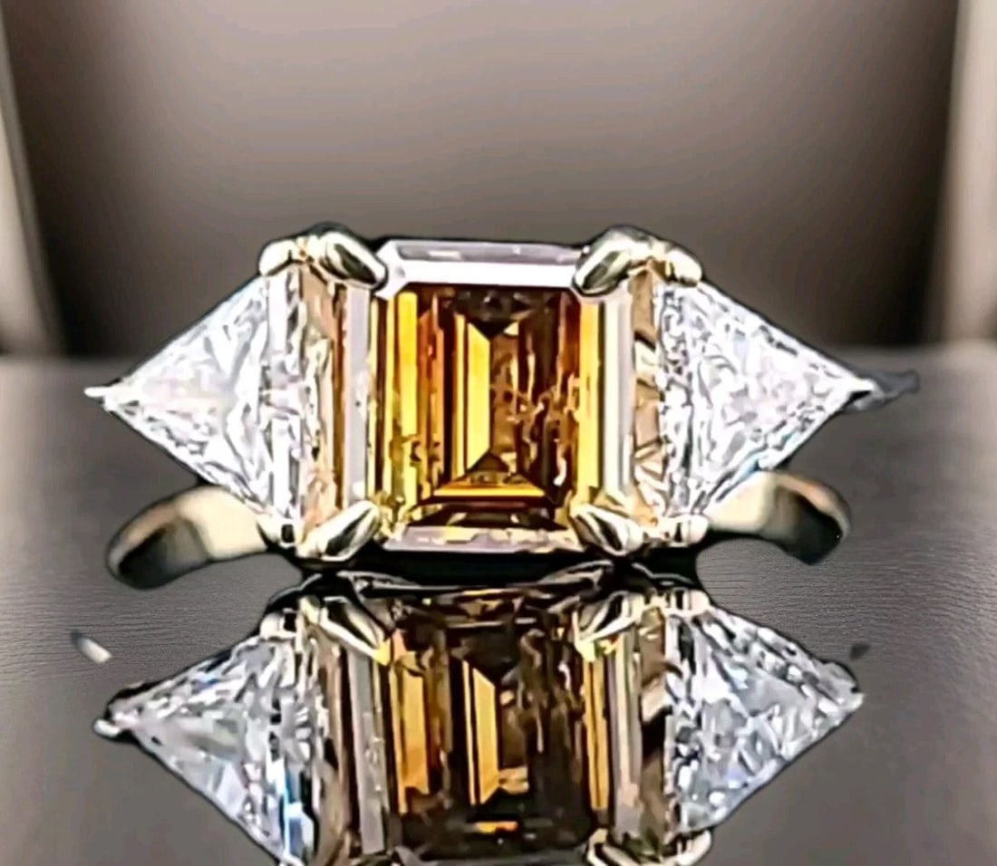 14k Yellow Gold Vintage Engagement ring 1.02ct. Champagne Diamond Emerald Cut: This beautiful vintage engagement ring is a true masterpiece. Crafted from 14k yellow gold, it features a stunning 1.02ct. Natural champagne diamond in an emerald cut. Size 6.8x6.5mm SI2 clarity, full