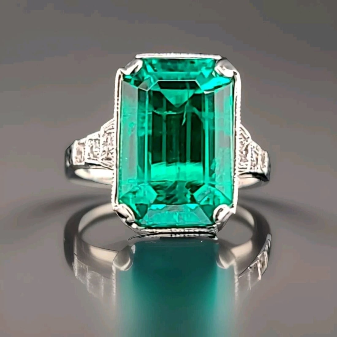 Vintage 14k White Gold Engagement Ring 4.63CT. Lab Grown Green Emerald Shape: VINTAGE 14K WHITE GOLD ENGAGEMENT RING 4.63CT. GREEN EMERALD RECTANGULAR CUT Vintage 14k white gold green emerald in a rectangular shape center set lab grown green emerald weight 4.63ct. size 13.6x8.8