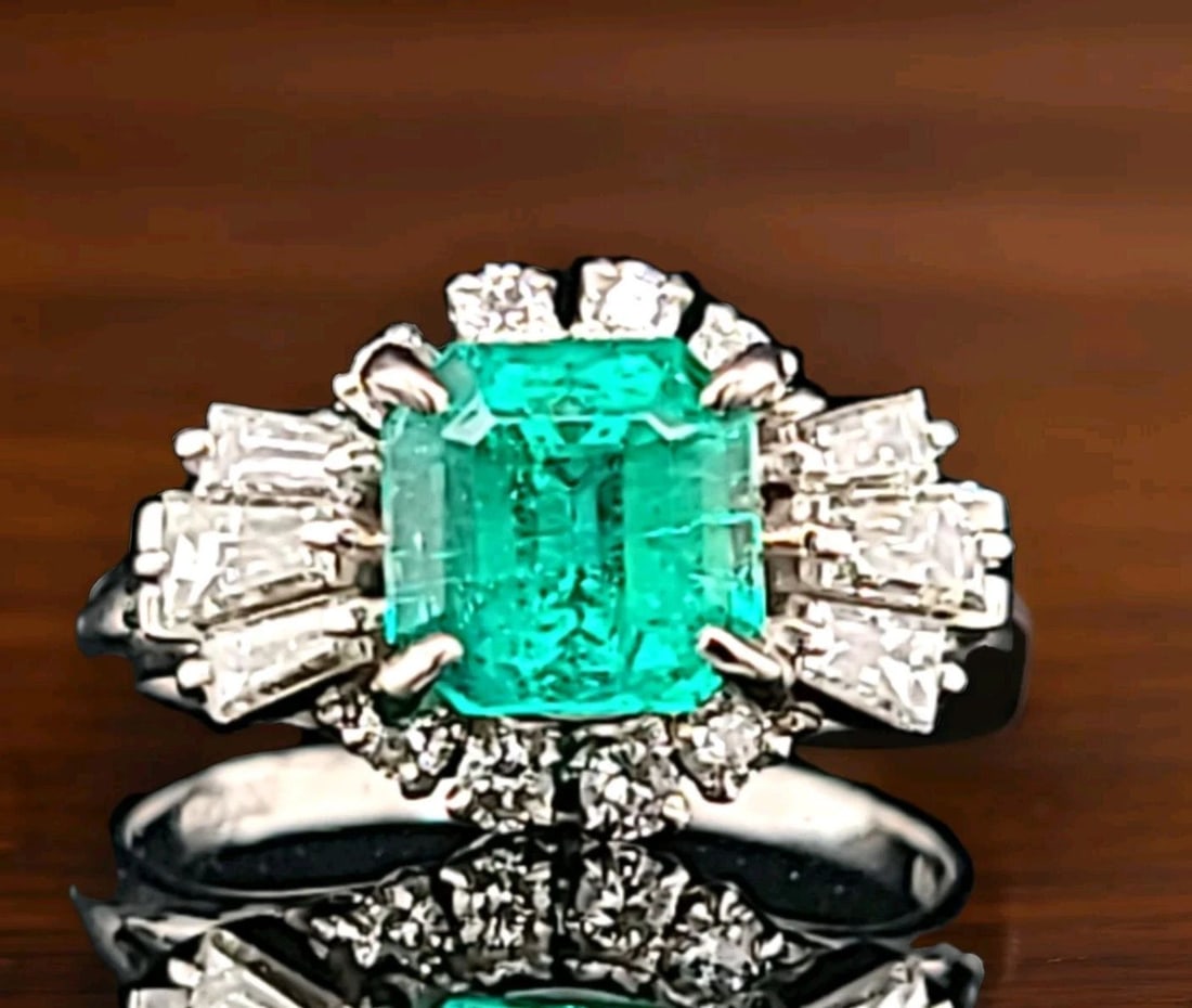 Platinum Vintage Filigree 1.67ct. Natural Colombia Emerald Ring Circ 1930's: This exquisite vintage ring from the 1930s is a true treasure. The stunning 1.67 carat natural Colombian emerald stone is beautifully complemented by the sparkling diamonds and intricate filigree desi