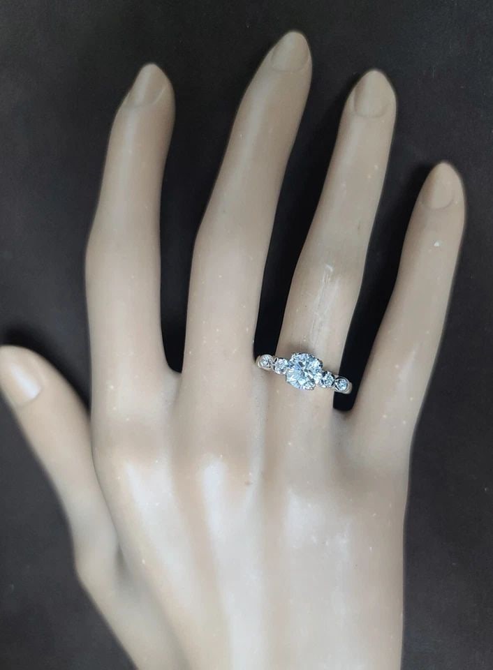 Vintage 14k White Gold Engagement Ring 1.01ct. Natural Round Cut Diamond: VINTAGE 14K WHITE GOLD ENGAGEMENT RING 1.01CT. NATURAL ROUND CUT DIAMOND This vintage engagement ring is a true beauty. Crafted from 14kt white gold, it features a stunning 1.01ct natural round cut di