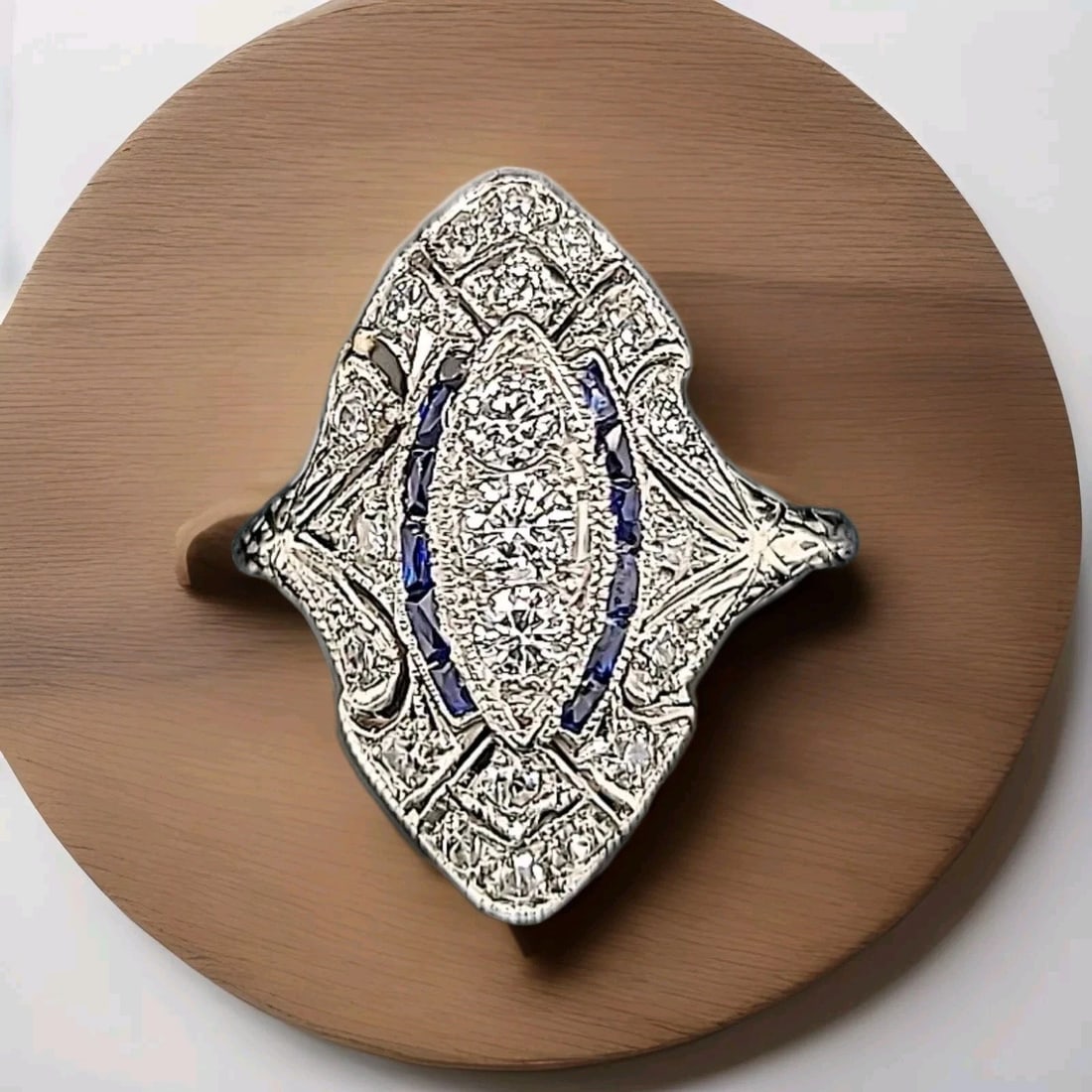 Platinum Vintage Art Deco Filigree 1.25ct. Diamond Sapphire Ring Circ 1920's: PLATINUM VINTAGE ART DECO FILIGREE 1.25CT. DIAMOND SAPPHIRE RING CIRC 1920'S Gorgeous Vintage art deco filigree PLATINUM ring circa 1930's center set three diamonds weight 0.35ct. SI1-G bright white s