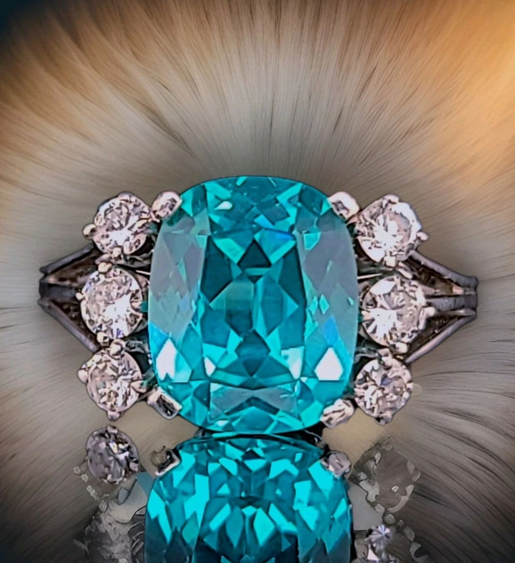 Vintage 18k White Gold Engagement Ring 6.28ct. Blue Tourmaline Cushion Shape: VINTAGE 18K WHITE GOLD ENGAGEMENT RING 6.28CT. BLUE TOURMALINE CUSHION SHAPE This stunning vintage ring features a cushion-cut lab-grown blue tourmaline with a vibrant neon blue color, center weighing