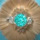 Vintage 14k White Gold Engagement Ring 4.10CT. Blue Neon Tourmaline Round Shape: VINTAGE 14K WHITE GOLD ENGAGEMENT RING 4.10CT. BLUE NEON TOURMALINE ROUND SHAPE This gorgeous vintage engagement ring is crafted in luxurious 14K white gold and showcases a breathtaking round lab-grow