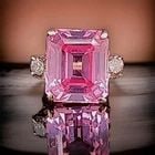 14k Rose Gold Engagement Ring 12.26ct. Lab Grown Peach Sapphire Emerald Shape: 14K ROSE GOLD ENGAGEMENT RING 12.26CT. LAB GROWN PEACH SAPPHIRE EMERALD SHAPE A stunning ring crafted in solid 14K rose gold, featuring a breathtaking emerald-cut lab-grown peach sapphire weighing app