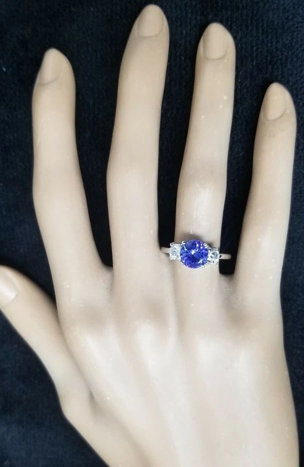 14K WHITE GOLD ENGAGEMENT RING 1.75ct NATURAL TANZANITE ROUND SHAPE: 14K WHITE GOLD ENGAGEMENT RING 1.75CT NATURAL TANZANITE ROUND SHAPE GORGEOUS 14K WHITE GOLD engagement ring natural tanzabite round shape Center natural tanzanite weight 1.75ct. size 7.5mm very nice m