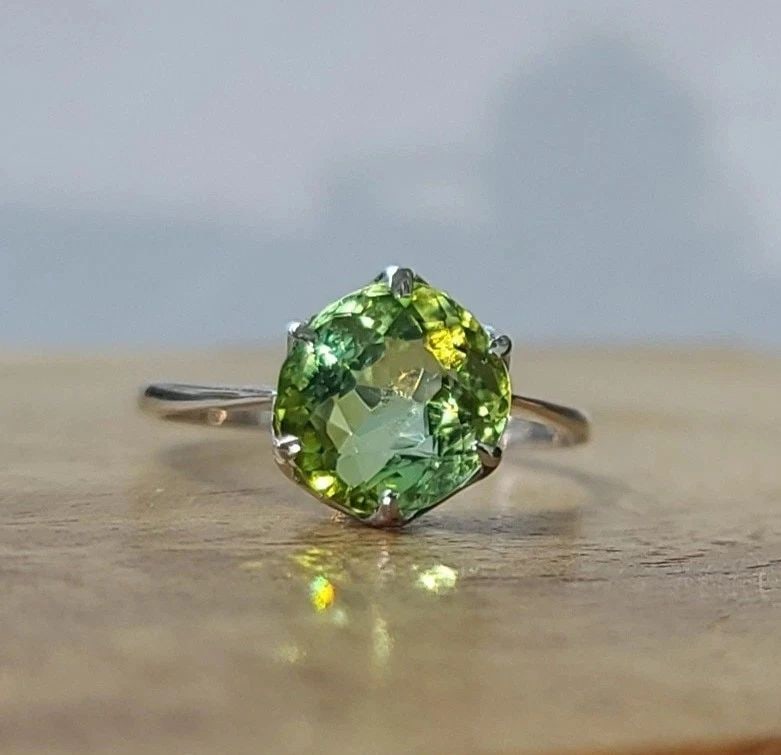 Vintage Platinum Engagement Ring 2.95CT. Natural Round Green Tourmaline: VINTAGE PLATINUM ENGAGEMENT RING 2.95CT. NATURAL ROUND GREEN TOURMALINE This vintage platinum engagement ring is a stunning piece of fine jewelry that will make a perfect gift for your loved one. The 