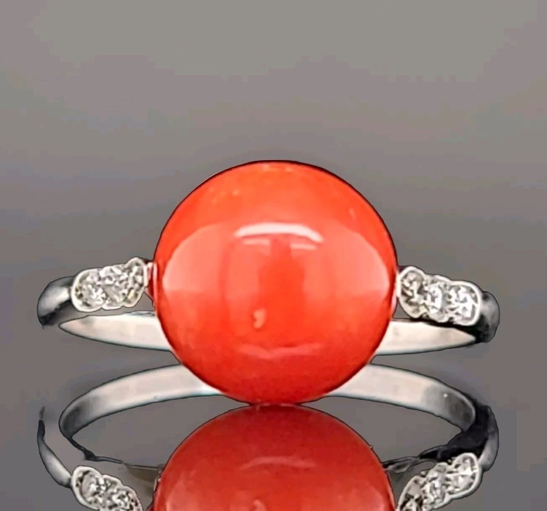 Filigree Art Deco Vintage Platinum Engagement Ring Round Natural Red Coral: FILIGREE ART DECO VINTAGE PLATINUM ENGAGEMENT RING ROUND NATURAL RED CORAL This vintage platinum engagement ring showcases a beautiful round natural red coral stone. The cocktail-style ring is adorned