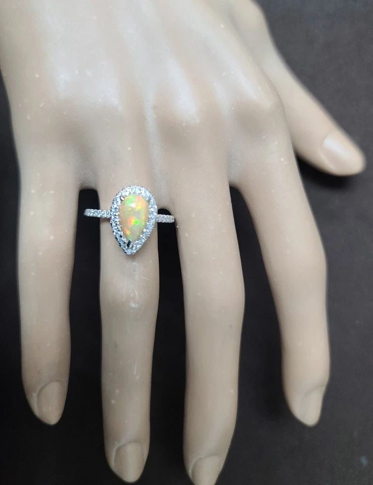 14K White Gold Engagement Ring 1.78CT. Natural Australian Opal Pear Shape: 14K WHITE GOLD ENGAGEMENT RING 1.78CT. NATURAL AUSTRALIAN OPAL PEAR SHAPE 14K WHITE GOLD OPAL ENGAGEMENT RING CENTER SET NATURAL OPAL PEAR SHAPE CABOCHON WEIGHT 1.78CARAT SIZE 10x6MM NATURAL OPAL GORG