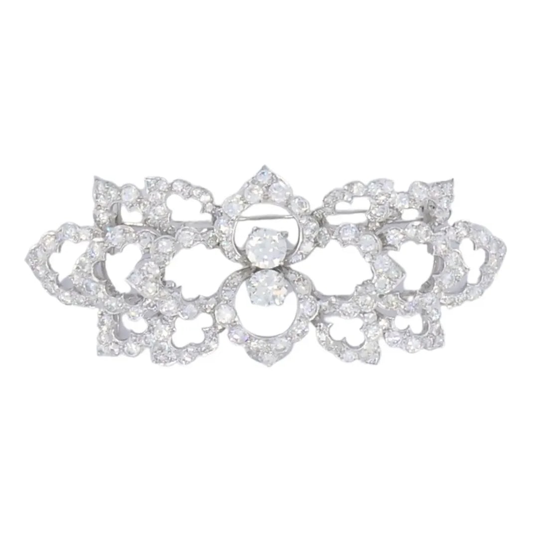 DAVID WEBB DIAMOND PLATINUM BROOCH FLORAL DESIGN: DAVID WEBB DIAMOND PLATINUM BROOCH FLORAL DESIGN NS JJTOO David Webb Diamond Platinum Brooch Floral Design This vintage David Webb brooch is a refined example of the designer’s work in platinum and 