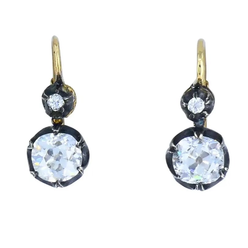 VICTORIAN 14K GOLD SILVER TWO-STONE DIAMOND EARRINGS OLD MINE CUT ANTIQUE: VICTORIAN 14K GOLD SILVER TWO-STONE DIAMOND EARRINGS OLD MINE CUT ANTIQUE Victorian Diamond Silver 14 karat Yellow Gold Earrings This pair of Victorian two-stone diamond earrings is crafted in 14k yel