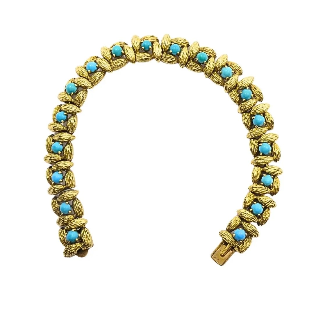 MAUBOUSSIN PARIS 18K GOLD TURQUOISE LINK BRACELET, 1960S: MAUBOUSSIN PARIS 18K GOLD TURQUOISE LINK BRACELET, 1960S DESIGNER Mauboussin CIRCA 1960s MATERIALS 18k Gold GEMSTONE Turquoise WEIGHT 39.7 Grams MEASUREMENTS 7 1/4" x 3/8” HALLMARKS Mauboussin, 