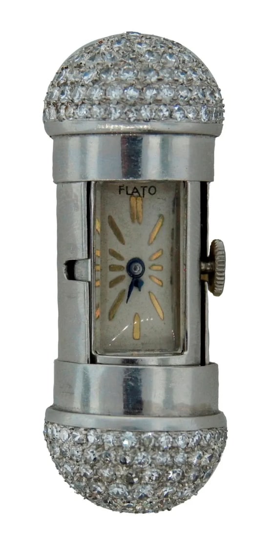 DIAMOND PLATINUM TRAVEL CLOCK WATCH PENDANT BY PAUL FLATO RARE ART DECO 1930S: DIAMOND PLATINUM TRAVEL CLOCK WATCH PENDANT BY PAUL FLATO RARE ART DECO 1930S Art Deco Diamond Platinum Travel Clock by Paul Flato This unique travel clock was created by Paul Flato in New York in the