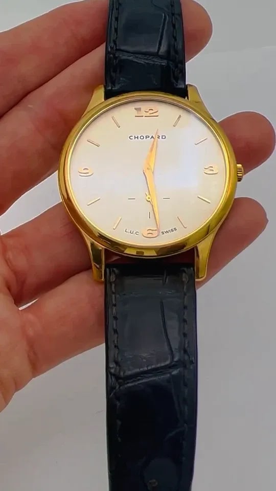 VINTAGE CHOPARD WATCH L.U.C 18K YELLOW GOLD LEATHER STRAP ESTATE JEWELRY: VINTAGE CHOPARD WATCH L.U.C 18K YELLOW GOLD LEATHER STRAP ESTATE JEWELRY CHOPARD L.U.C 18 karat Yellow Gold Watch on Leather Strap A classic Chopard L.U.C 12.96 caliber watch made of 18 karat yellow g