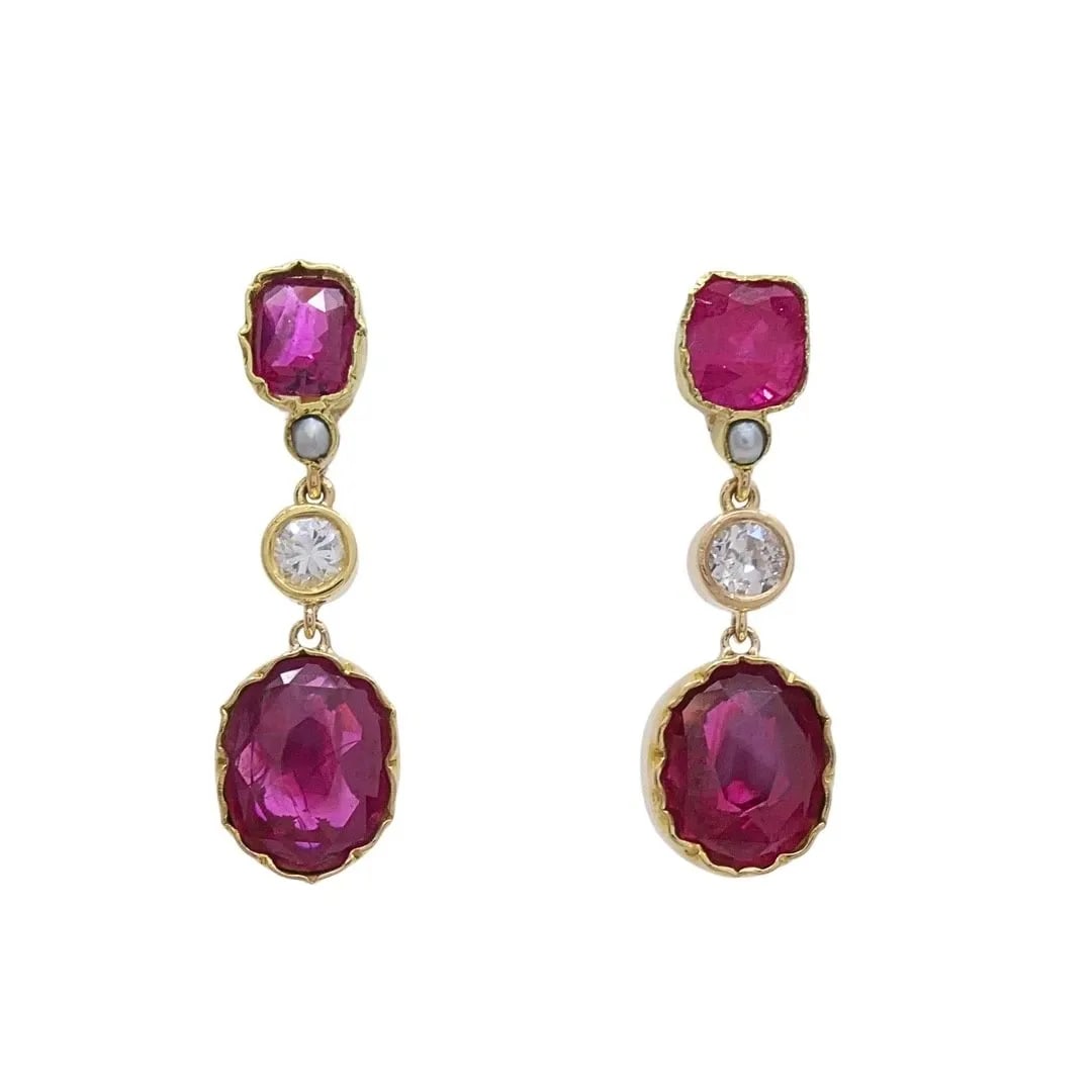 14K GOLD RUBY DROP EARRINGS DIAMOND ACCENT: 14K GOLD RUBY DROP EARRINGS DIAMOND ACCENT Materials 14K Gold, 12K Gold. G.F. Gemstone Ruby, Diamond Weight 4 Grams Measurement 1/4" x 1" Hallmarks 14K, 20.12K. G.F. ITEM DETAILS 14k Gold Ruby Drop Ea