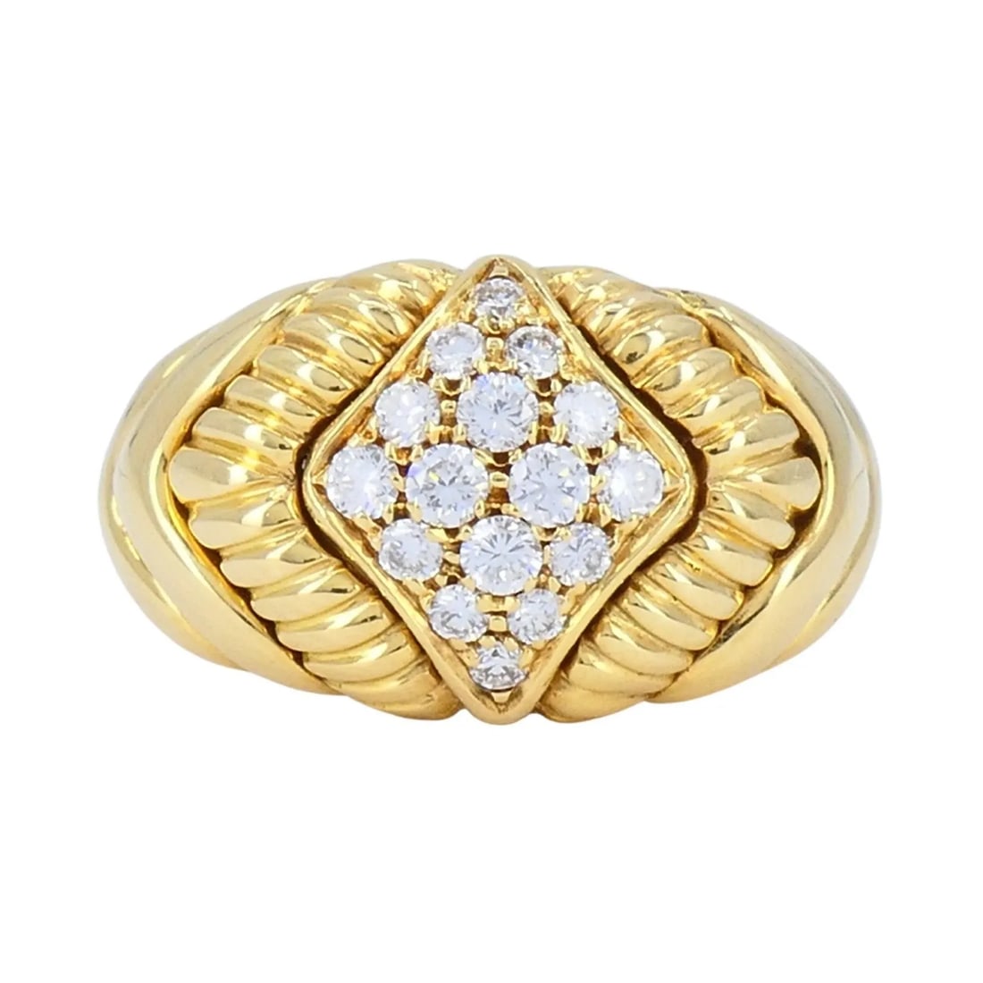 VINTAGE BOUCHERON 18K GOLD DIAMOND DOME RING: VINTAGE BOUCHERON 18K GOLD DIAMOND DOME RING This Boucheron ring, crafted in 18k yellow gold, dates to the late 1980s to early 1990s. The design features sculpted fluted shoulders that frame a raised 