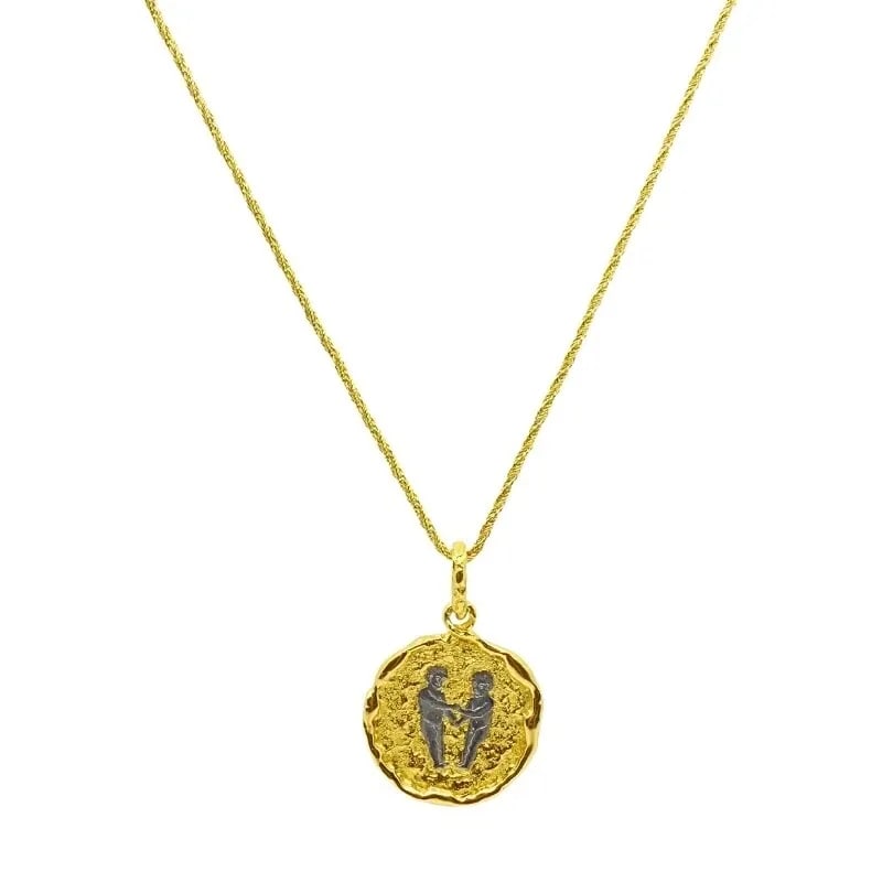 CHAUMET GEMINI ZODIAC PENDANT WHITE YELLOW GOLD NECKLACE: DESIGNER: Chaumet, Paris CIRCA: 1980’s MATERIALS: 18k Yellow Gold WEIGHT: 25.1 Grams MEASUREMENTS: Pendant Diameter - 1 1/8", Chain Length - 15.5" HALLMARKS: Chaumet, Paris, 870085 ITEM DETAILS: Cha
