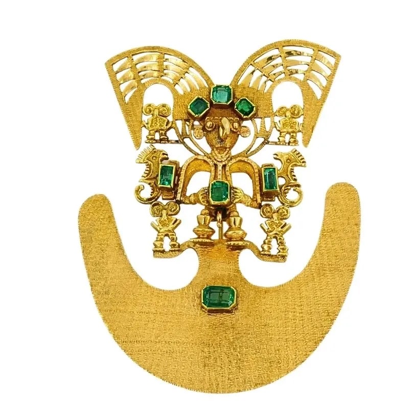 18K GOLD BROOCH/PENDANT EMERALDS PRE-COLUMBIAN JEWELRY: 18K GOLD BROOCH/PENDANT EMERALDS PRE-COLUMBIAN JEWELRY Product details: CIRCA: Late 20th Century MATERIALS: 18k Gold GEMSTONE: Emerald WEIGHT: 40 Grams MEASUREMENTS: 2 5/16" x 3" HALLMARKS: 18K ITEM D