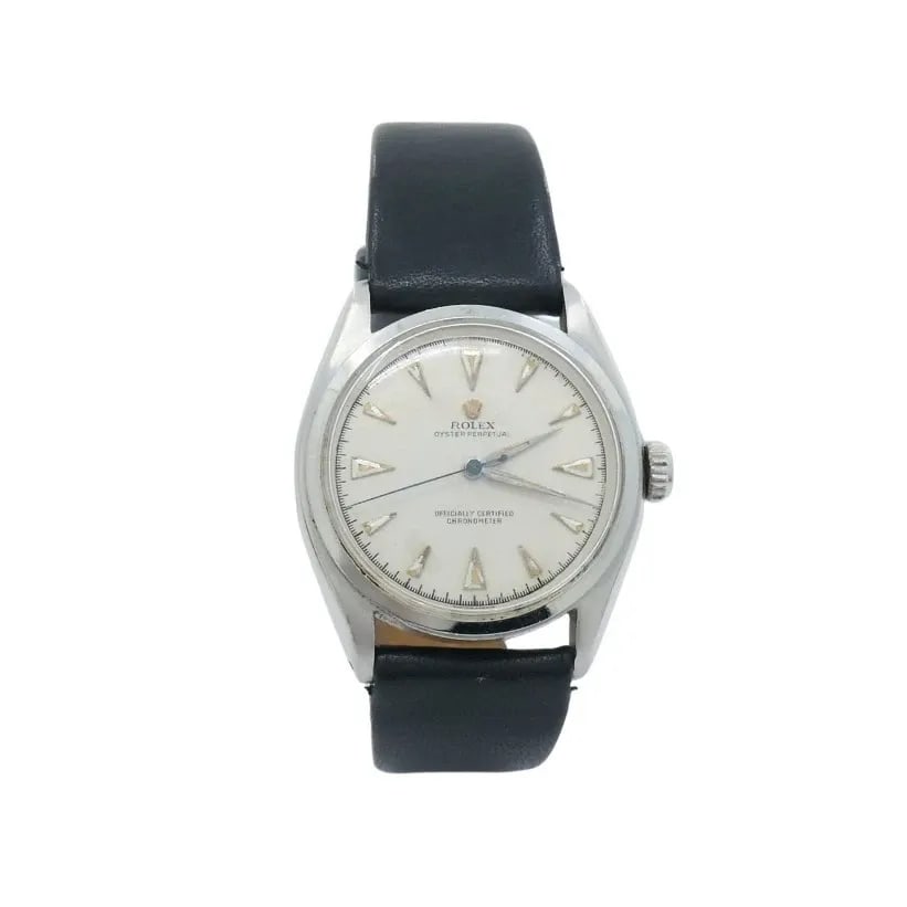 VINTAGE ROLEX OYSTER PERPETUAL 6084 STAINLESS STEEL WRISTWATCH: VINTAGE ROLEX OYSTER PERPETUAL 6084 STAINLESS STEEL WRISTWATCH NS ATOO Vintage Rolex Oyster Perpetual 6084 Stainless Steel Wristwatch Crafted in stainless steel, this vintage Rolex Oyster Perpetual 60