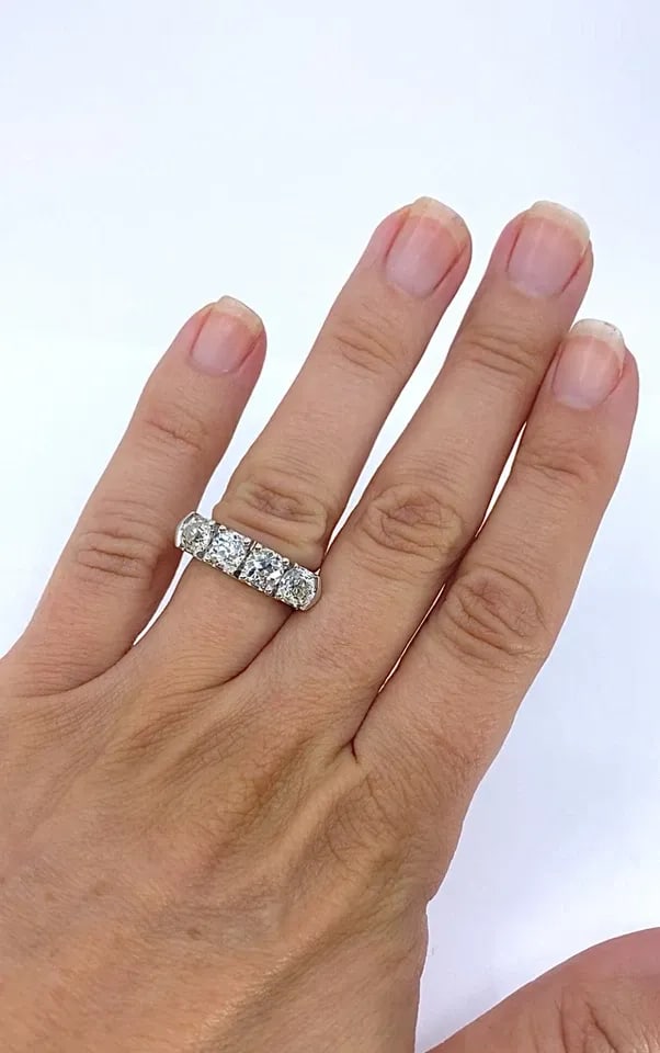 MID-CENTURY PLATINUM FOUR-STONE DIAMOND RING: Mid-Century Platinum Four-Stone Diamond Ring ES AOOO Product details: MATERIALS: Platinum GEMSTONE: Diamond WEIGHT: 12.7 Grams RING SIZE: 5.75 HALLMARKS: PLAT ITEM DETAILS: Mid-Century Platinum Four-S