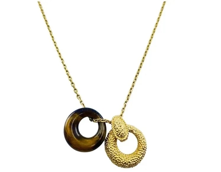 VAN CLEEF & ARPELS GOLD TIGER’S EYE NECKLACE: VAN CLEEF & ARPELS GOLD TIGER’S EYE NECKLACE DESIGNER: Van Cleef & Arpels CIRCA: 1980’s MATERIALS: 18k Yellow Gold GEMSTONE: Tiger’s Eye WEIGHT: 12.3 grams MEASUREMENTS: The chain’s length is 