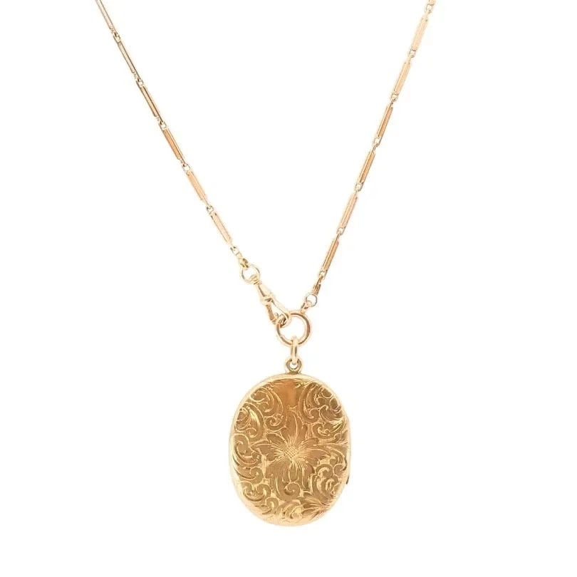 14K GOLD ENGRAVED LOCKET PENDANT GOLD ANTIQUE WATCH CHAIN: 14K GOLD ENGRAVED LOCKET PENDANT GOLD ANTIQUE WATCH CHAIN DESIGNER: Unknown CIRCA: 1900s MATERIALS: 14k Gold WEIGHT: Chain - 10.8 Grams; Pendant - 18.4 Grams MEASUREMENTS: Pendant - 1 5/16" x 1 11/16"