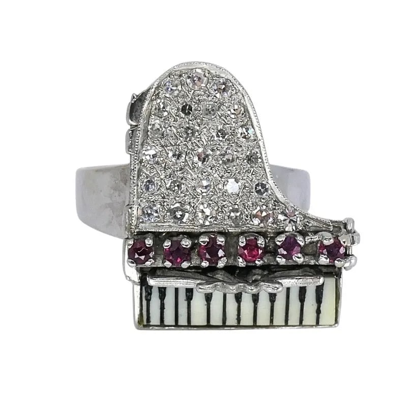 VINTAGE 14K GOLD GRAND PIANO DIAMOND GEMSTONE RING: VINTAGE 14K GOLD GRAND PIANO DIAMOND GEMSTONE RING MATERIALS 14k Gold GEMSTONE Diamond WEIGHT 12.7 Grams MEASUREMENTS 13/16" x 15/16" RING SIZE 10.75 HALLMARKS 14K ITEM DETAILS Vintage 14k Gold Grand 