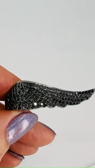 VINTAGE GARRARD BLACK DIAMOND WING RING 18K GOLD: VINTAGE GARRARD BLACK DIAMOND WING RING 18K GOLD JGTO Vintage GARRARD 18 karat White Gold black Diamond Wing Ring A dramatic Garrard black diamond Wing ring crafted of 18k gold. The ring features a sc