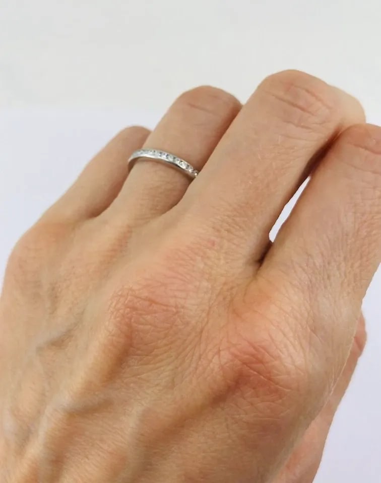 VINTAGE TIFFANY & CO. DIAMOND ETERNITY BAND PLATINUM SIZE 6: VINTAGE TIFFANY & CO. DIAMOND ETERNITY BAND PLATINUM SIZE 6 This vintage Tiffany & Co. eternity band ring is crafted in platinum and set with a single row of round brilliant cut diamonds. The design f