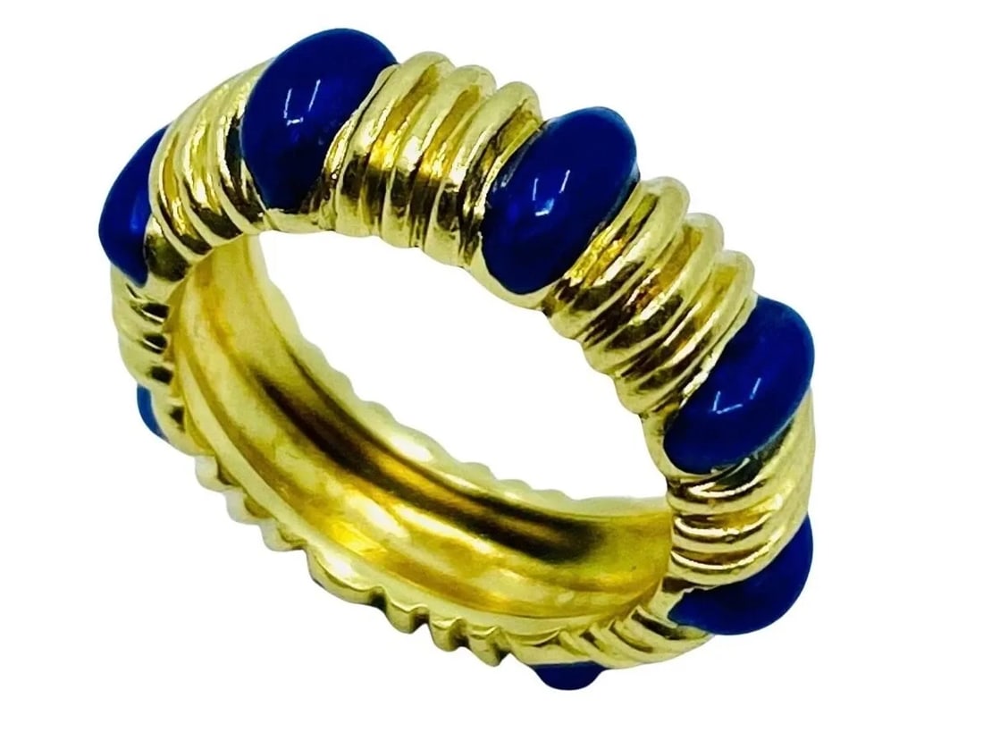 TIFFANY & CO. BLUE ENAMEL GOLD BAND RING: TIFFANY & CO. BLUE ENAMEL GOLD BAND RING TIFFANY & CO. BLUE ENAMEL GOLD BAND RING DESIGNER: Tiffany & Co. CIRCA: 1990’s MATERIALS: 18k Yellow Gold GEMSTONE: Enamel WEIGHT: 7.8 grams RING SIZE: 5 HAL