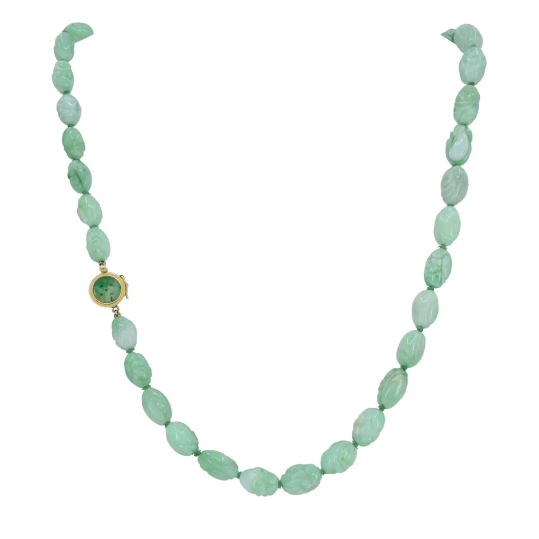 VINTAGE 14K GOLD APPLE JADE CARVED BEAD NECKLACE, CIRCA 1960S: Vintage 14k Gold Apple Jade Carved Bead Necklace, Circa 1960s KL JIOO This 14k gold apple jade carved bead necklace features a continuous strand of hand carved jade beads, each exhibiting a soft green
